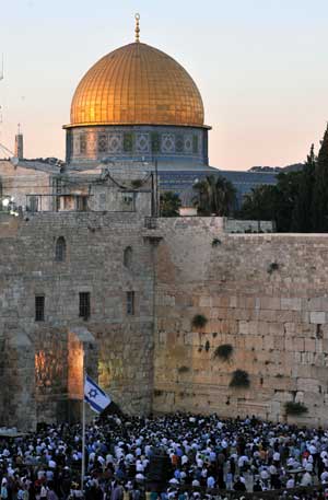 Demonstrators gather for a rally to denounce Israeli government's policy on Jewish settlements, at the Western Wall in Jerusalem's Old City on June 21, 2009. Israeli Prime Minister Benjamin Netanyahu vowed in a keynote speeck on June 14 that Israel would not build any new settlements and would refrain from expanding existing Israeli communities in the West Bank. 