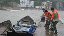 Rescue workers save a fisherman in Tannianggong, Fuzhou City. Torrential rain, strong winds and landslides triggered by tropical storm Linfa have left one dead and another six missing in east and south China provinces, local authorities said on June 22.