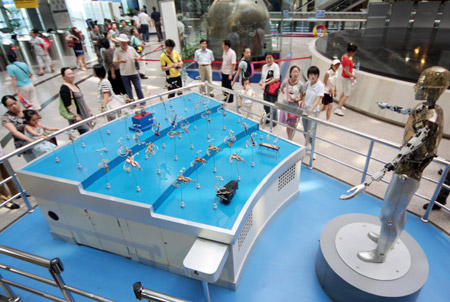 Visitors look around at the old exhibition hall of China Science and Technology Museum in Beijing, capital of China, on June 24, 2009. 