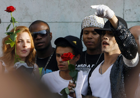 A Michael Jackson impersonator mourns for American pop icon Michael Jackson who died at the age of 50 in Los Angeles on Thursday, in Paris, France, on June 26, 2009.