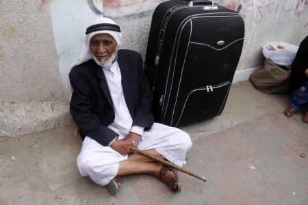 A Palestinian man waits to cross into Egypt through the Rafah border crossing in the southern Gaza Strip, on June 27, 2009. The Egyptian authorities reopened, partially, the Rafah crossing at the border with the Palestinian territory of Gaza Strip on Saturday for three days.