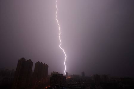 Lightning is seen over Wuhan, capital of central China's Hubei Province, as a thunderstorm hits the city on June 28, 2009.