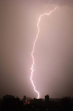 Lightning is seen over Wuhan, capital of central China's Hubei Province, as a thunderstorm hits the city on June 28, 2009.