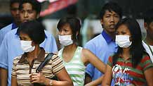 People wearing facial masks walk out of a hospital in Manila, capital of the Philippines, on June 29, 2009. The total number of confirmed cases of A/ H1N1 flu has risen to 604 in the Philippines as far as Sunday night, according to figures released by the Philippine Ministry of Health.