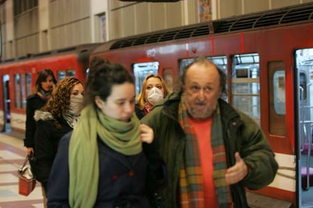 A citizen wearing a mask walks at the subway station in Buenos Aires, capital of Argentina, on June 30. A health emergency was declared in the city and province of Buenos Aires to prevent A/H1N1 flu from fast spreading.