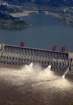 Photo taken on July 1, 2009 shows two deep-holes and a trash way hole opened for sluicing the mounting flood water, on the Three Gorges Dam in Yichang, central China's Hubei Province. 