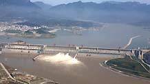 Photo taken on July 1, 2009 shows the Three Gorges Dam opening two deep-holes and a trash way hole for sluicing the mounting flood water, in Yichang, central China's Hubei Province. The Three Gorges Reservoir has high influx of flooded water along with the arrival of Yangtze River's main flood season with recent days' persistent rainfalls.