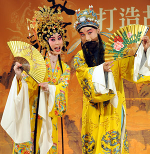 Two top-class Kunqu opera performers enact in a section of the traditional repertoire Palace of the Eternal Youth, during a New Presentation of Palace's Lingering Appeal, in a serial activity sponsored by the Palace Museum of Taipei to endue the traditional opera with its precious collections of curio in the Palace Museum of Taipei, southeast China's Taiwan, on July 2, 2009.