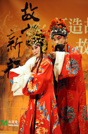 Two top-class Kunqu opera performers enact in a section of the traditional repertoire Palace of the Eternal Youth, during a New Presentation of Palace's Lingering Appeal, in a serial activity sponsored by the Palace Museum of Taipei to endue the traditional opera with its precious collections of curio, in the Palace Museum of Taipei, southeast China's Taiwan, on July 2, 2009.