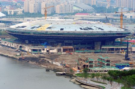Photo taken on July 4, 2009 shows the Performing Arts Center under construction for the Shanghai 2010 World Expo in Shanghai, east China. The Shanghai 2010 World Expo is to open on May 1, 2010.