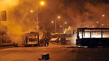 Rioters took to the street of Urumqi on Sunday evening.