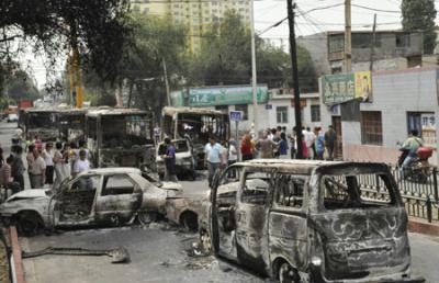 Vehicles set on fire and destroyed in Sunday night's riot are seen on Beiwan Street in Urumqi, capital of northwest China's Xinjiang Uygur Autonomous Region, on July 6, 2009. 