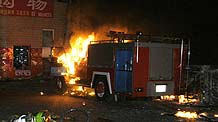 Vehicles set on fire and destroyed in Sunday night's riot are seen on Beiwan Street in Urumqi, capital of northwest China's Xinjiang Uygur Autonomous Region, July 6, 2009.