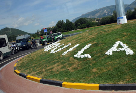 Security members guard on the road to the makeshift media village for 2009 G8 summit in L'Aquila, Italy, on July 7, 2009. Media personnel from across the world began to swarm into the media village in L'Aquila, the quake-stricken capital of central Italy's Abruzzo region where 2009 G8 summit and other related international meetings will be held from July 8 to 10.