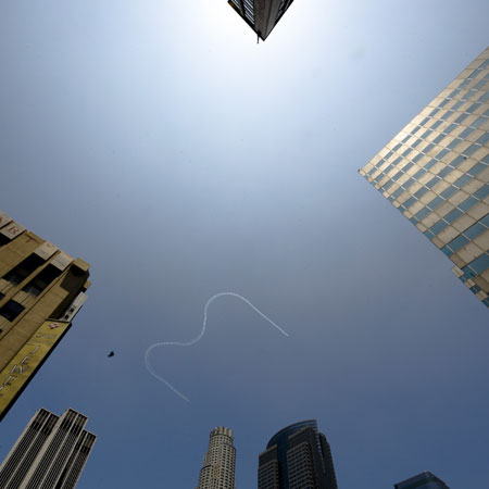 A plane leaves a letter M in the sky over Los Angeles on July 7, 2009. A star-studded public tribute to Michael Jackson was held here Tuesday with thousands of randomly selected fans joining family and friends to bid farewell to the King of Pop. 