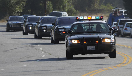 A motorcade carring family and friends of Michael Jackson heads to the Forest Lawn cemetery for Jackson's private memorial in Los Angeles on July 7, 2009. A star-studded public tribute to Michael Jackson was held at the Staples Center in LA Tuesday with thousands of randomly selected fans joining family and friends to bid farewell to the King of Pop. 