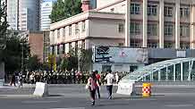 Armed police patrol on a road in Urumqi, capital of northwest China's Xinjiang Uygur Autonomous Region, on July 8, 2009. The city has lifted a traffic curfew on Wednesday morning, which began on 9:00 PM on Tuesday.