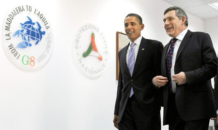 US President Barack Obama (L) and British Prime Minister Gordon Brown arrive at the main conference hall of the G8 summit in l'Aquila, Italy, on July 8, 2009. Leaders of the G8 industrialized countries began their summit on Wednesday, with the world economic crisis and climate change at the top of their three-day agenda. 