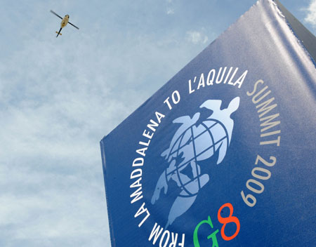 A helicopter is seen flying above the makeshift media village for 2009 G8 summit in L'Aquila, Italy, on July 7, 2009.