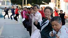 Citizens do morning exercises in Urumqi, capital of northwest China's Xinjiang Uygur Autonomous Region, on July 11, 2009.