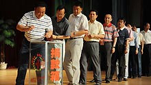 Local officials donate money for victims in the Urumqi riot in Altay, northwest China's Xinjiang Uygur Autonomous Region, on July 12, 2009.