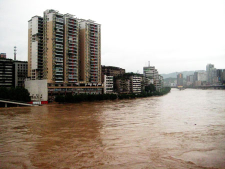 Photo taken on July 11, 2009 shows the flooded houses along the Binhe Road in Dazhou City, southwest China&apos;s Sichuan Province.