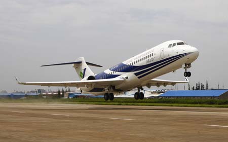 China's first domestically-developed regional ARJ21 jet takes off in east China's Shanghai on July 15, 2009. The jet on Wednesday made its longest trial flight of 1,300 kilometers in about two hours from Shanghai to Xi'an, capital of northwest China's Shaanxi Province.