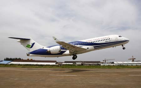 China's first domestically-developed regional ARJ21 jet takes off in east China's Shanghai on July 15, 2009. The jet on Wednesday made its longest trial flight of 1,300 kilometers in about two hours from Shanghai to Xi'an, capital of northwest China's Shaanxi Province.