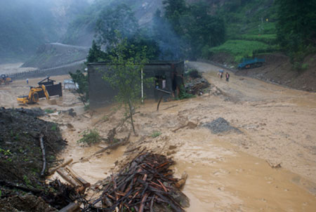 The path for pedestrian at the Donghekou Earthquake Relics Park is flooded in Qingchuan County, southwest China's Sichuan Province, on July 15, 2009. Heavy rains that began on Tuesday have killed one people and caused the ohter missing in Qingchuan County.