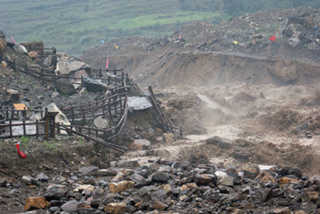 The equipment of the Donghekou Earthquake Relics Park is ruined by flood in Qingchuan County, southwest China's Sichuan Province, on July 15, 2009. Heavy rains that began on Tuesday have killed one people and caused the ohter missing in Qingchuan County.