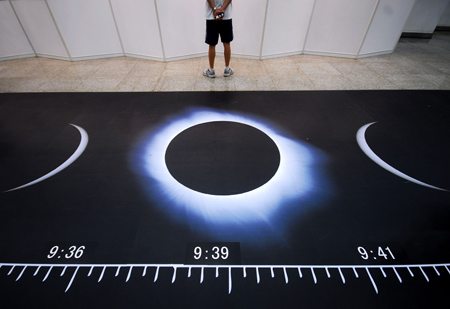 Photo taken on July 11, 2009 shows the sketch maps illustrating the whole process of the full solar eclipse during a popular science exhibition on the introduction to the forthcoming 2009 Full Solar Eclipse at the Shanghai Science and Technology Museum in Shanghai, east China. The upcoming full solar eclipse, predicted to betide on July 22 and believed to be the longest of its kind in 500 years, will be visible in most parts of the Shanghai municipality. 