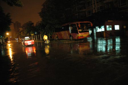 Photo taken at about 4:30 AM Beijing Time on July 19, 2009 shows a street in the rainstorm in downtown Shenzhen City, south China's Guangdong Province.