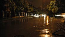 Photo taken at about 4:30 AM Beijing Time on July 19, 2009 shows a street in the rainstorm in downtown Shenzhen City, south China's Guangdong Province.