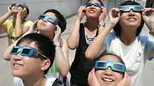 Children simulate to view solar eclipse with goggles as a preparation for the coming one on July 22, in north China's Tianjin, on July 19, 2009. A total solar eclipse will be seen on July 22 in the area along the Yangtze River in central China, while a partial solar eclipse could be seen in Beijing, capital of China, and Tianjin.