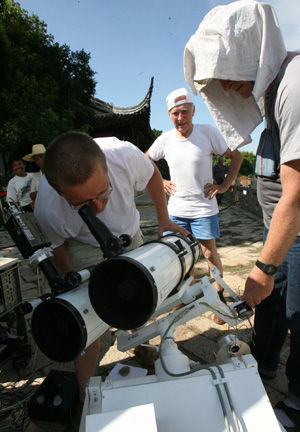 Astronomers from Poland test an astronomy telescope in the Shangfangshan Forest Park in Suzhou, east China&apos;s Jiangsu Province, on July 20, 2009.