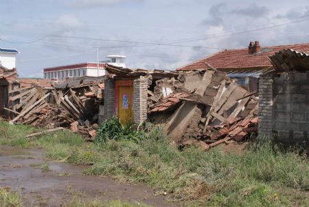 The picture taken on July 21, 2009 shows the debris of a collapsed house after a rainstorm hit Maqu County in northwest China's Gansu Province, killing at least five people.