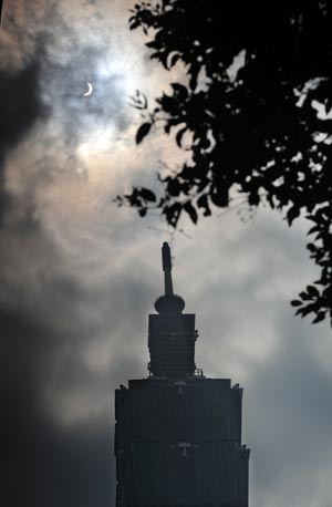 Photo taken on July 22, 2009 shows the solar eclipse occurring over Taipei of southeast China's Taiwan.