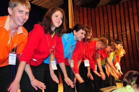 Staff members of the 'Ocean' All-Russia Children's Care Center demonstrate relaxing movements to students from China's earthquake areas, in Vladivostok, Russia, on July 23, 2009.