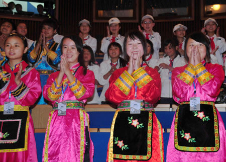 Students from China's earthquake areas sing songs at the 'Ocean' All-Russia Children's Care Center in Vladivostok, Russia, on July 23, 2009. 