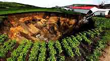 Photo taken on July 23, 2009 shows a cave at the Xinyongfeng Coal Mine where a flooding accident took place in Jixi City, northeast China's Heilongjiang Province. Twenty-three miners were trapped underground after a flooding accident at the coal mine in Jixi city. Rescue work is under way, and preliminary investigation showed heavy rain was to blame for the accident.