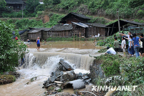 A photo taken on Sunday, July 27, 2009 shows a flooded village in Hongjiang district of Huaihua City, central China's Hunan Province. 