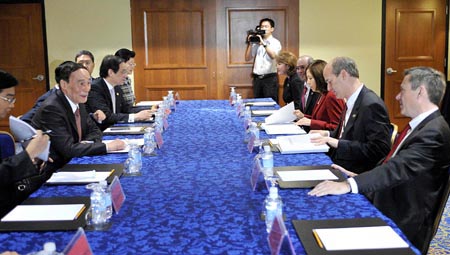 Chinese Vice Premier Wang Qishan (L2) meets with U.S. Congressmen in Washington, D.C., on July 26, 2009, the day before the first round of the China-U.S. Economic and Strategic Dialogue, which is to be held in Washington, D.C. from July 27 to 28. (Xinhua/Zhang Yan) 