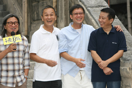 Hong Kong director Wai Keung Lau (R2) of the Chinese movie 'Bodyguards and Assassins' attends the closing ceremony in Shengqiang Film and TV Base in Shanghai, China, on July 27, 2009. 