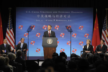 US President Barack Obama (C) delivers a speech while Chinese Vice Premier Wang Qishan (2nd L), State Councilor Dai Bingguo (1st L), US Secretary of State Hillary Clinton (2nd R) and US Treasury Secretary Timothy Geithner (1st R) listen during the opening ceremony of the China-US Strategic and Economic Dialogue in Washington, the United States, on July 27, 2009. 