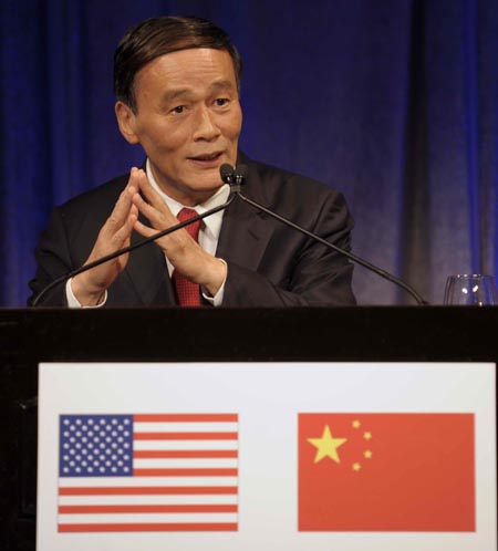 Chinese Vice Premier Wang Qishan delivers a speech during a welcoming reception held by United States friendly groups at Ritz Carlton Hotel in Washington D.C., capital of the United States, on July 28, 2009.
