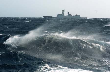 Chinese naval &apos;Xuzhou&apos; missile frigate sails in the roaring Arabian sea, the Indian Ocean on July 28, 2009.