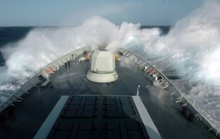 Chinese naval 'Xuzhou' missile frigate sails in the roaring Arabian sea, the Indian Ocean on July 28, 2009. The Chinese Naval Escort Fleets encountered monstrous waves in the Arabian Sea on July 28. The fleet changed its course accordingly and safely passed the stormy area at 4:00 PM Beijing time, on July 29, 2009.