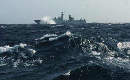 Chinese naval 'Xuzhou' missile frigate sails in the roaring Arabian sea, the Indian Ocean on July 28, 2009.
