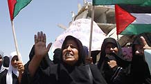 Palestinians attend a protest calling the lifting of the Israeli blockade in Rafah, southern Gaza Strip, on July 29, 2009. UN agencies called on Israel to allow construction materials into the Gaza Strip so that schools damaged in this year's war can be rebuilt in time for the new school year.