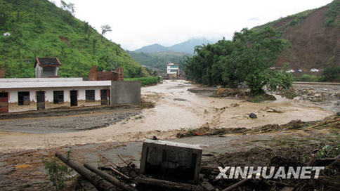 Photo taken on July 27, 2009. Twenty-four were confirmed dead and four missing after downpours triggered havoc Monday in Miyi County, Panzhihua City, said the city government. Another 44 were injured.